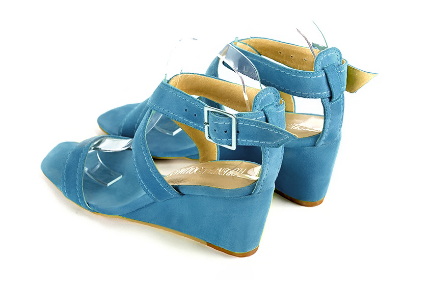 Women's peacock blue elegant fully open cross straps sandals. Square toe. Medium wedge heels - Rear view